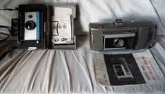 Lot of 2 Polaroid Cameras – Model T66 Electric Eye Land Kit – Model 210 Auto