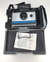 Polaroid 210 Land Camera – Accessories Included (Manual, Strap, and Some Film)
