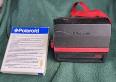Polaroid SX-70 Land Camera Model 3 Cool Cam, Black/Red with 1 pack of film.