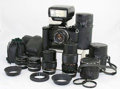 Olympus OM 1 MD camera 35mm SLR + 5x OM Zuiko lens + flash + bags.