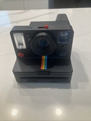 black ⁠Polaroid Originals OneStep+ instant film camera,
