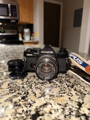 Olympus OM-2S Program 35mm SLR Film Camera Black w/ Zuiko 50mm f/1.8 – Mint