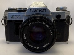 Canon AE-1 Silver 35mm Film SLR Camera w/ Canon FD 50mm f/1.8 Lens