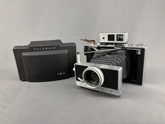 Polaroid 180 Land Camera w/Tominon 114mm f/4.5 Lens Zeiss Viewfinder, W/Shell