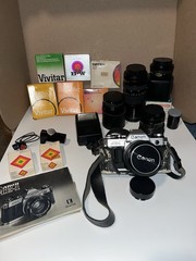 Canon AE-1 Silver SLR Film Camera w/ Canon Lens, Flash, Filters, Bag & Book
